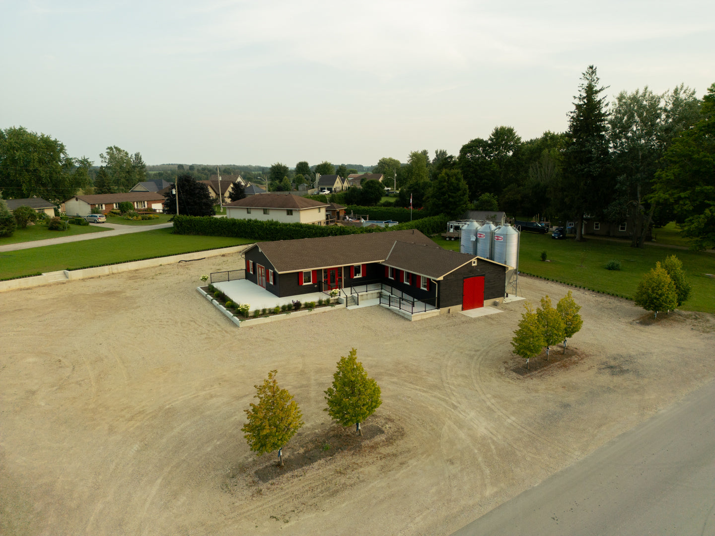 Red door milling building from drone sht